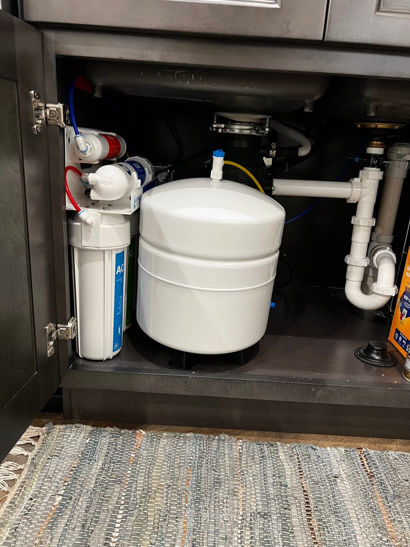 Under-sink reverse osmosis drinking water system installed in a Tampa kitchen cabinet
