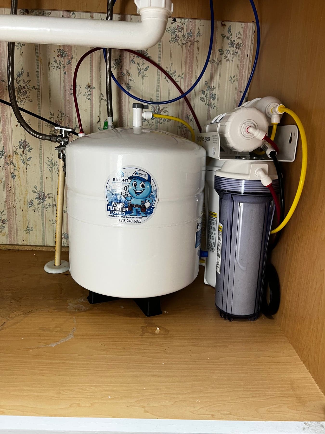 Under-sink reverse osmosis filter installation with prefilters and storage tank